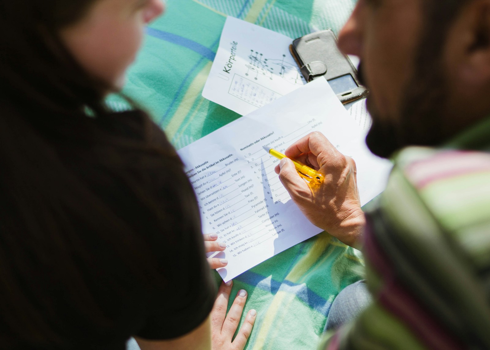 Teacher and student during a language lesson for comparing group and private Russian classes